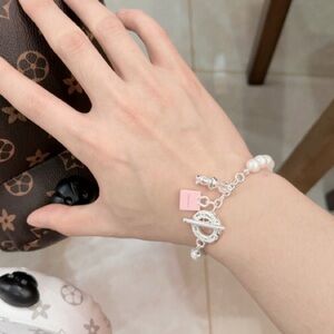 Tiffany & Co. Chic Silver and Pink Charm Bracelet